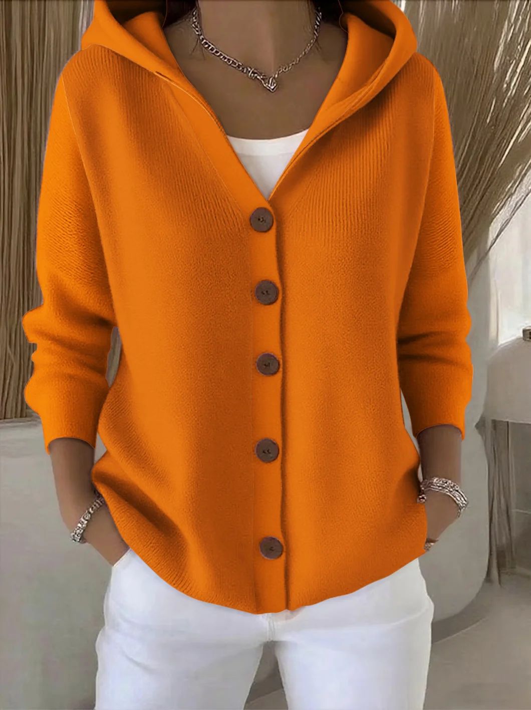 Dorien | Capuchonvest met knopen